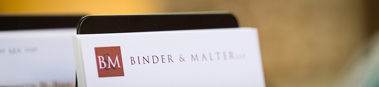 Business card featuring a prominent red and white logo, showcasing a professional design.